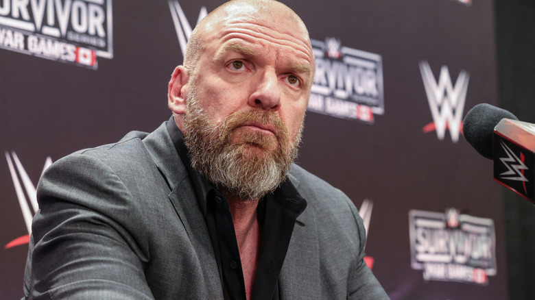 Triple H sternly looking over the Raw rundown