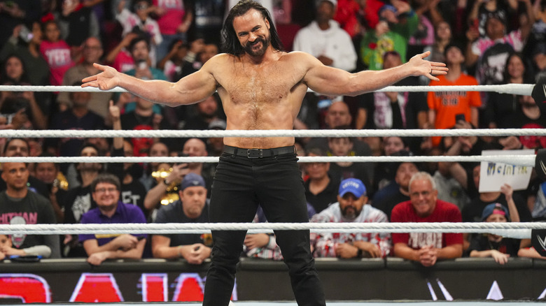 Drew McIntyre smiles and poses in the ring after laying out Jey Uso on "WWE Raw."