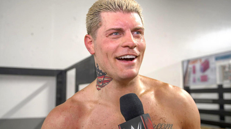 Cody Rhodes being interviewed backstage at a WWE event