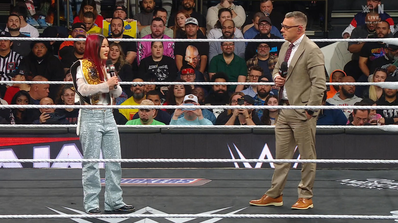 SKY and Cole standing in the ring speaking to each other