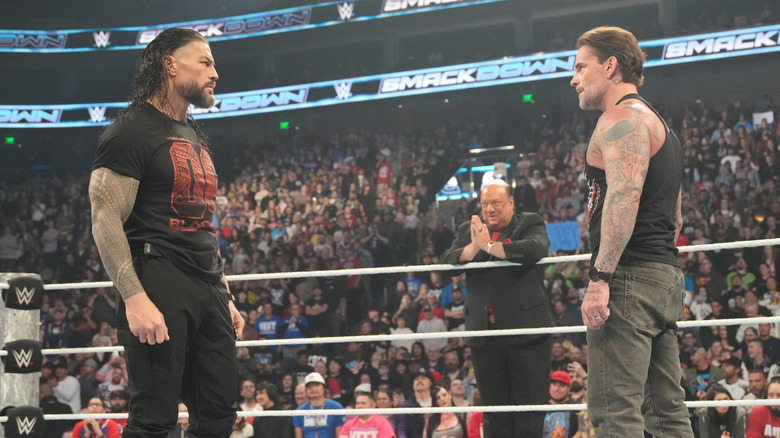 Roman Reigns staring down CM Punk