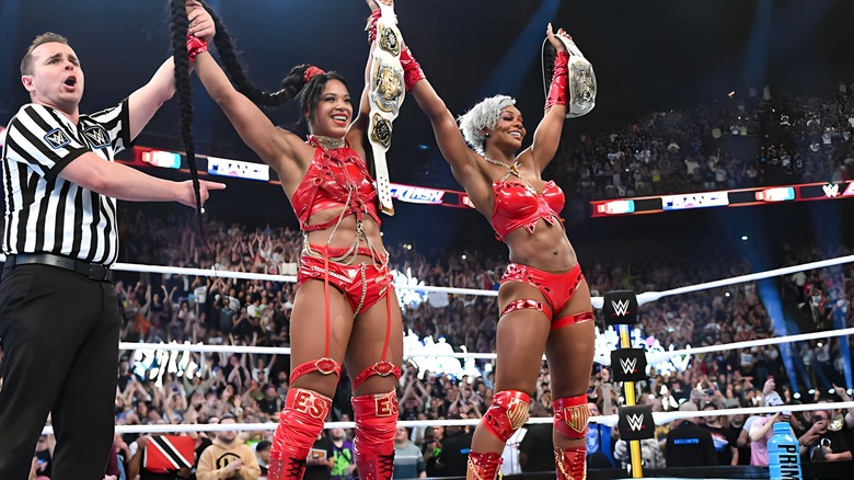 Bianca Belair and Jade Cargill raise title belts
