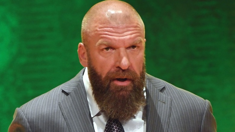 Triple H grinning