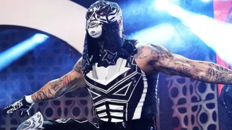 Penta poses on the stage before heading down the ramp for a match on AEW programming.