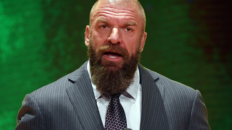Triple H wearing a suit