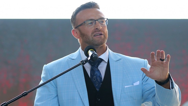 Nick Aldis at the podium