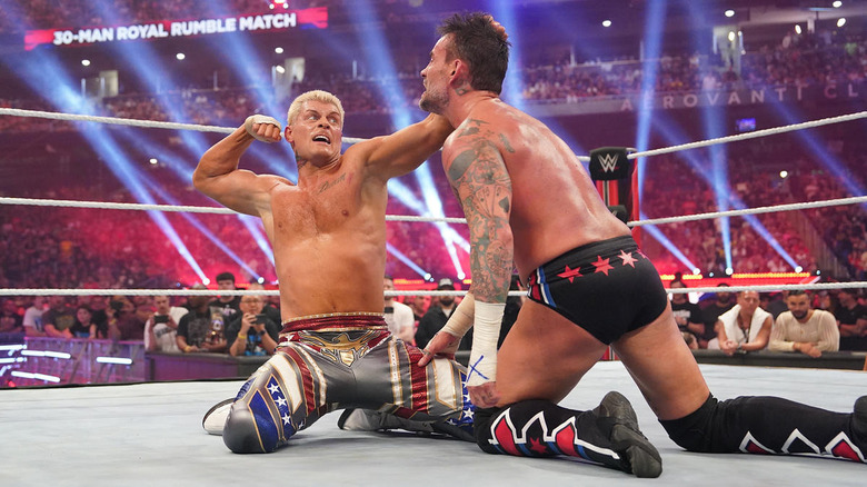 Cody Rhodes punching CM Punk