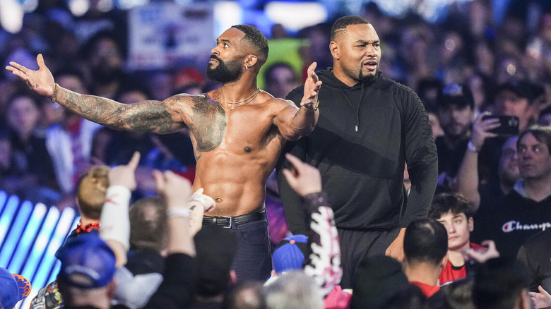 Montez Ford and Angelo Dawkins stand before the crowd at WWE Royal Rumble