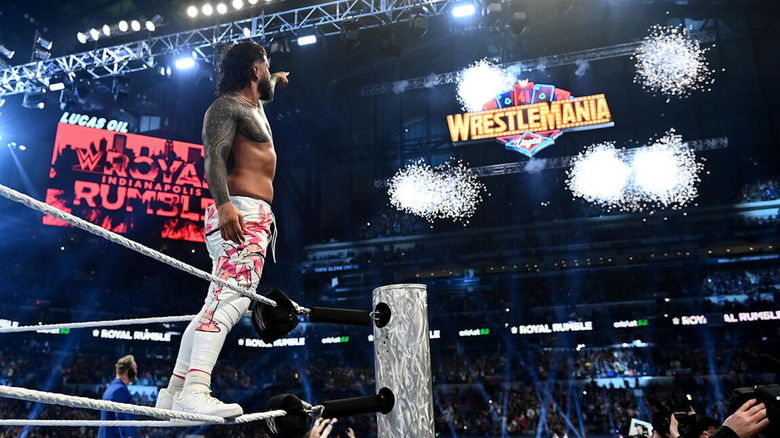 Jey Uso points at the WrestleMania sign at WWE Royal Rumble.