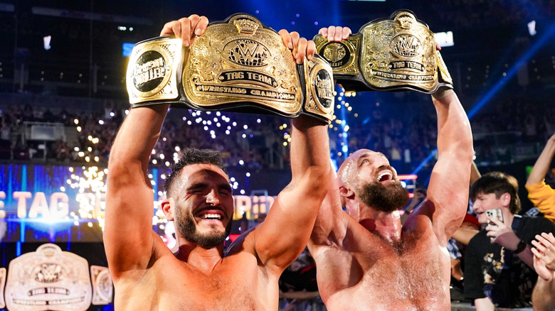 DIY celebrate with their WWE Tag Team Title belts