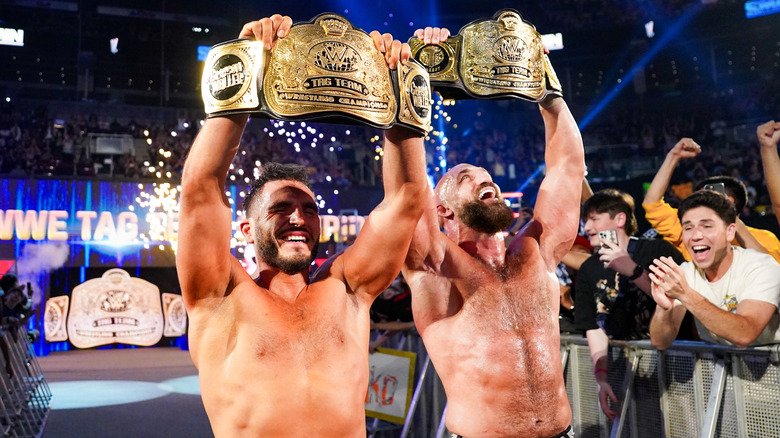 DIY celebrate with their WWE Tag Team Title belts