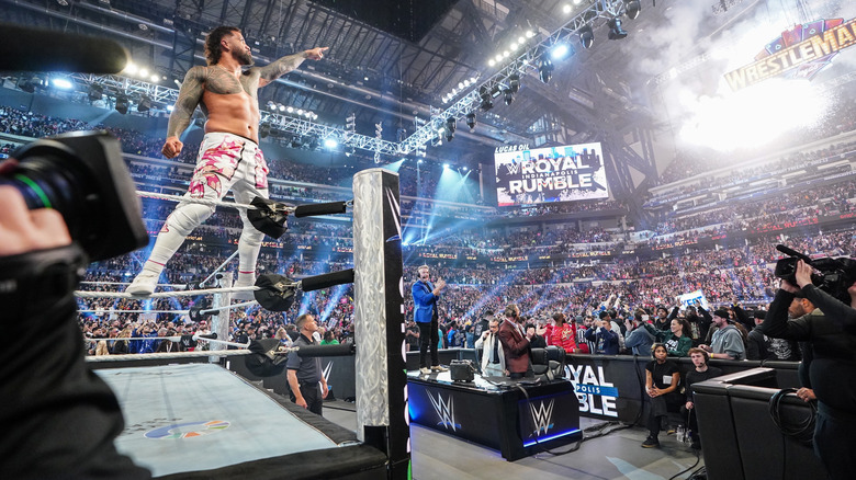 Jey Uso points at the WrestleMania sign