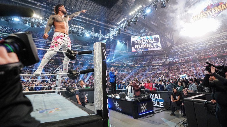 Jey Uso points at the WrestleMania sign