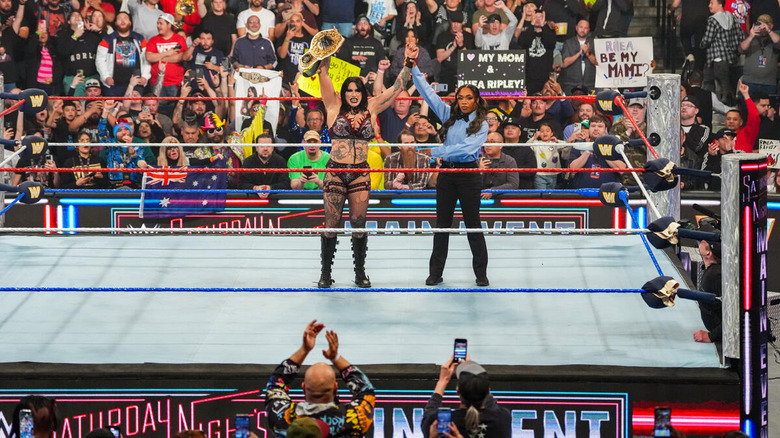 Rhea Ripley celebrates with her title in the ring on "WWE Saturday Night's Main Event"