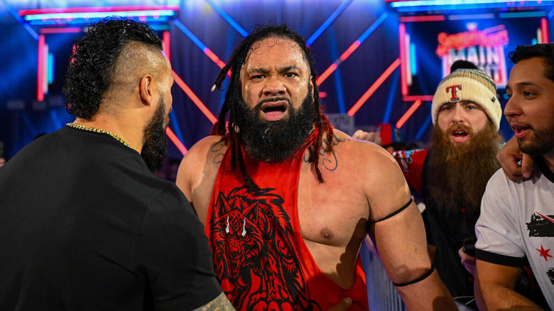 Tama Tonga dragging away Jacob Fatu on "WWE Saturday Night's Main Event."