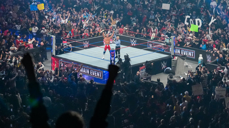 Cody Rhodes soaks in the adulation of the crowd as the ref raises his arm in the ring on Saturday Night's Main Event