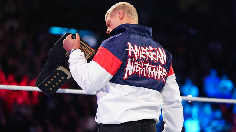 Cody Rhodes holds up the WWE Championship on "WWE SmackDown."