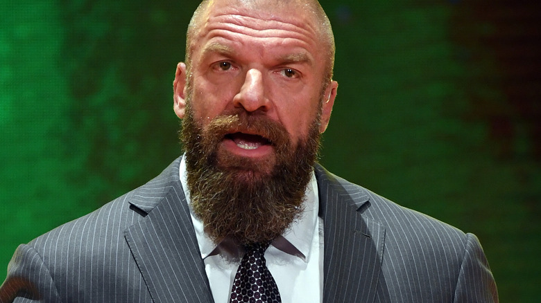 Triple H speaks during a press conference