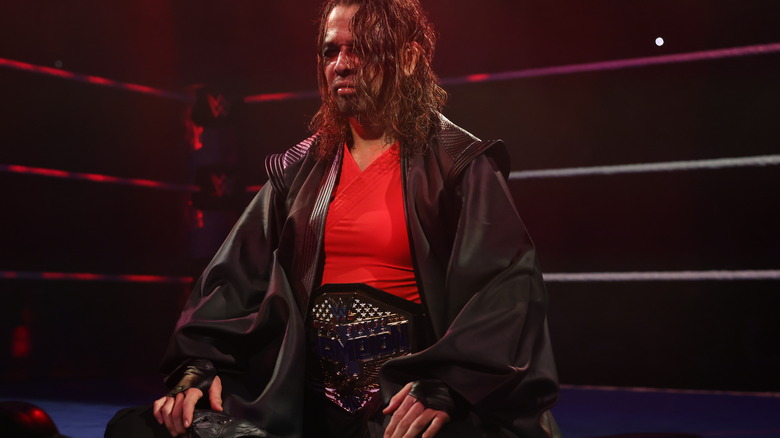 Shinsuke Nakamura sitting in the ring