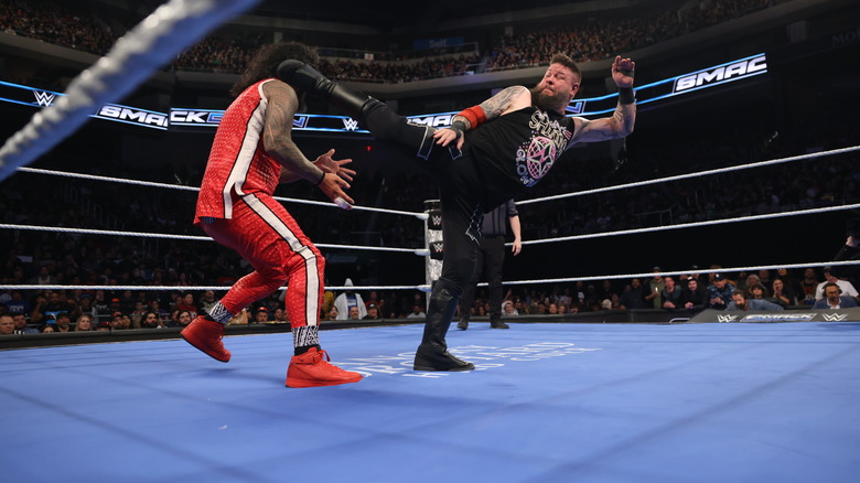 Kevin Owens superkicks Jimmy Uso in the face on "WWE SmackDown."