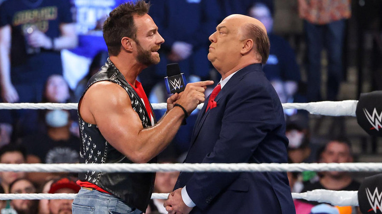 LA Knight talking to Paul Heyman