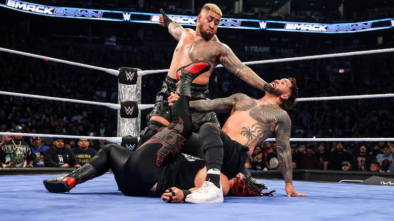 Solo Sikoa prepares to break up Jey Uso pin on Jacob Fatu by hitting him with the Samoan Spike on "WWE SmackDown."