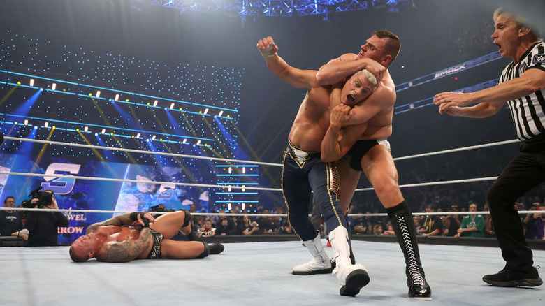 GUNTHER chokes out Cody Rhodes while Randy Orton writhes on the mat on "WWE SmackDown."