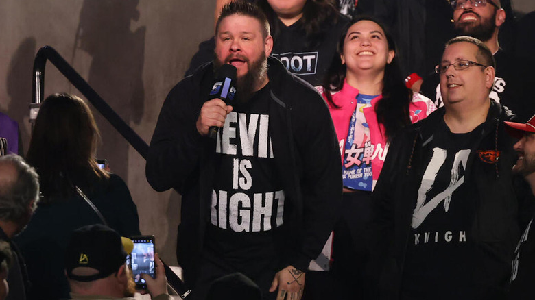 Kevin Steen speaking into microphone