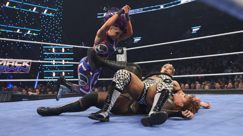 Bayley breaks up a pin between Bianca Belair and Nia Jax on "WWE SmackDown"