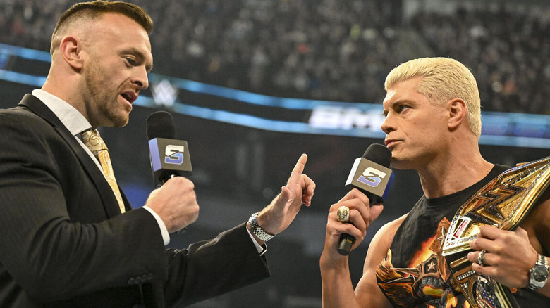 Nick Aldis talking to Cody Rhodes and holding up a finger on "WWE SmackDown."