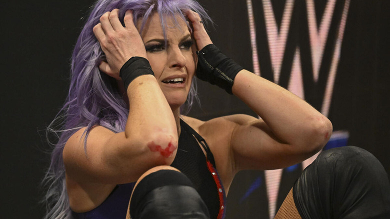 Candice LeRae puts her hands to her head outside the ring on "WWE SmackDown."