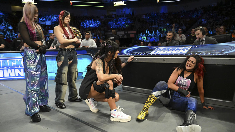 Damage CTRL looks down at Bayley