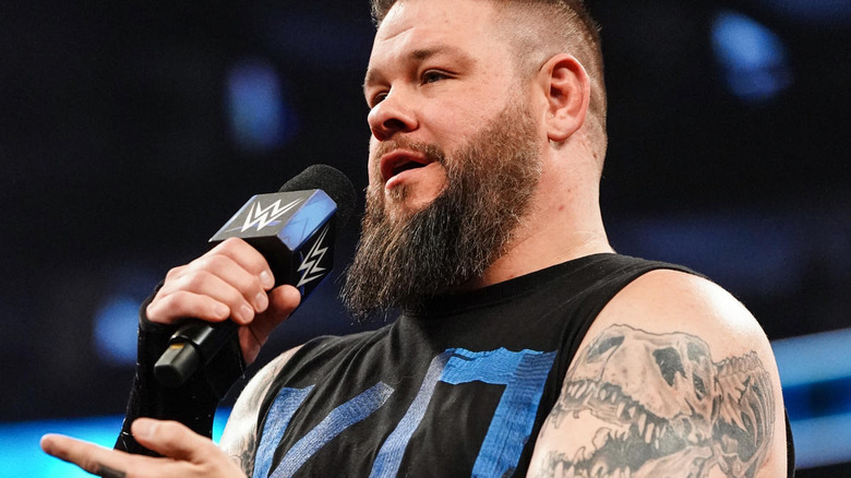 Kevin Owens with a microphone