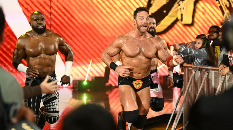 Apollo Crews, LA Knight, and Andrade run down to the ring on "WWE SmackDown."