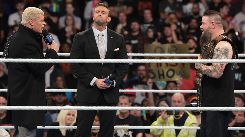 Cody Rhodes speaks to Kevin Owens with Nick Aldis beside them in the ring on "WWE SmackDown."