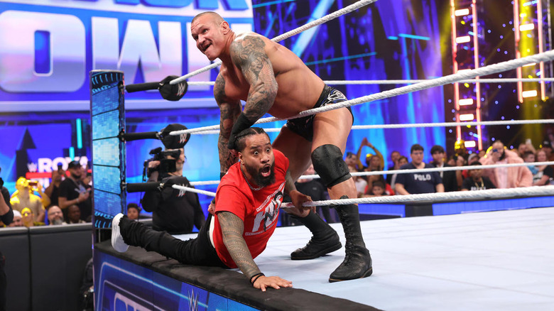 Randy Orton grabbing Jimmy Uso