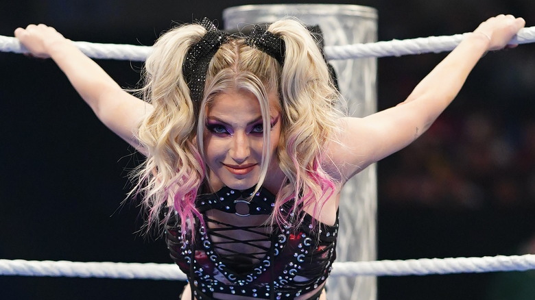 Alexa Bliss with her hands on the top rope behind her on "WWE SmackDown"