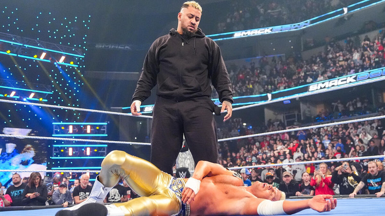 Solo Sikoa standing over Cody Rhodes in the ring on "WWE SmackDown"