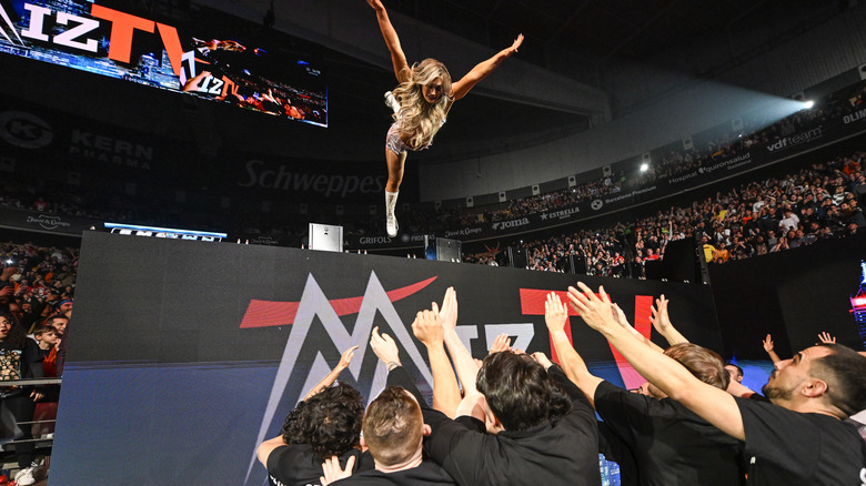 Tiffany Stratton in air against WWE Security during SmackDown at Olimpic Arena on March 14, 2025 in Barcelona, Spain.