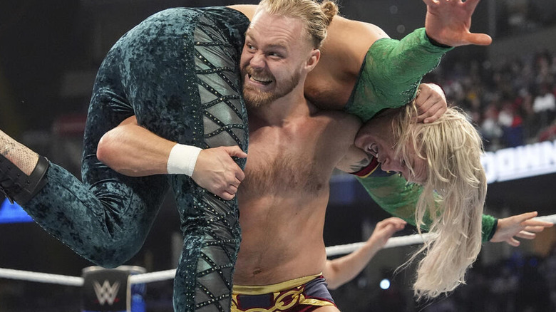 Tyler Bate lifts Elton Prince on his shoulders