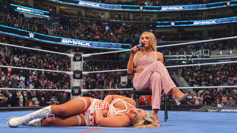 Charlotte Flair speaks to an injured Tiffany Stratton