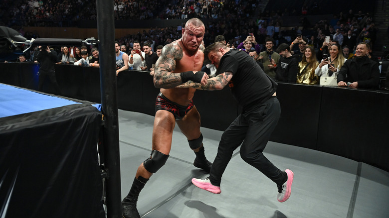 Kevin Owens fights with Randy Orton