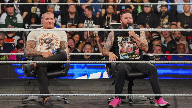 Randy Orton sitting next to Kevin Owens