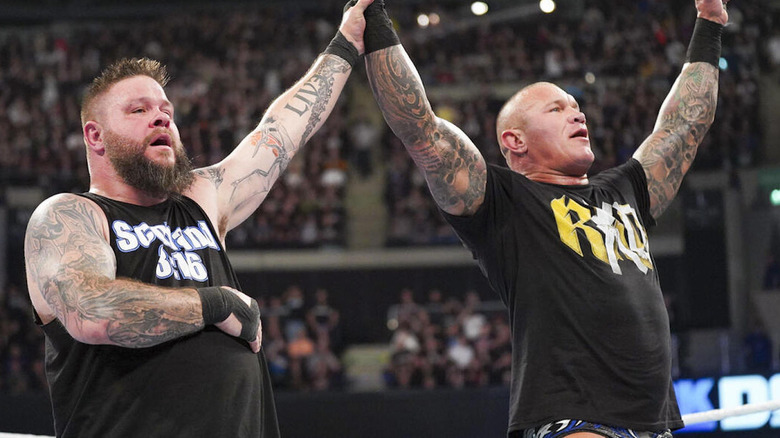 Kevin Owens raises Randy Orton' arm
