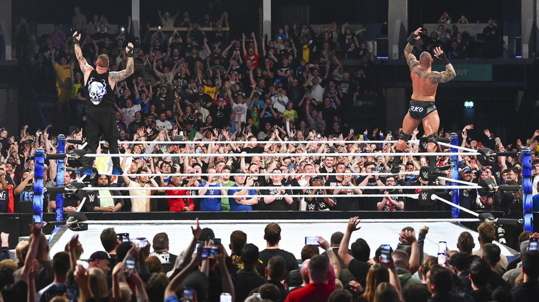 Kevin Owens and Randy Orton pose on turnbuckles