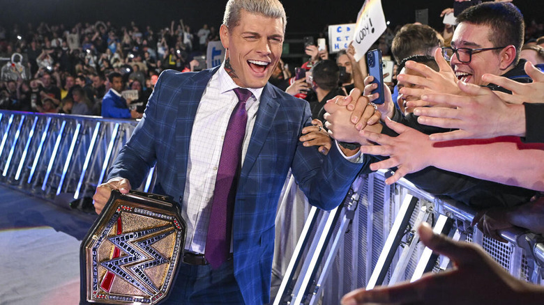 Cody Rhodes slaps hands with fans in Glasgow