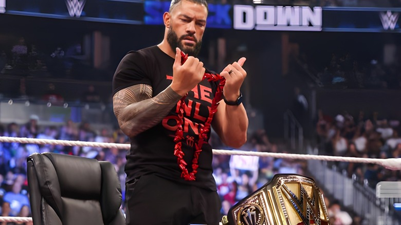 Roman Reigns stares at his lei