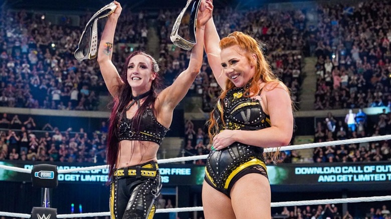 Alba Fyre and Isla Dawn hold up their newly won WWE Women's Tag Team Championships