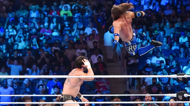 AJ Styles jumping at Karrion Kross