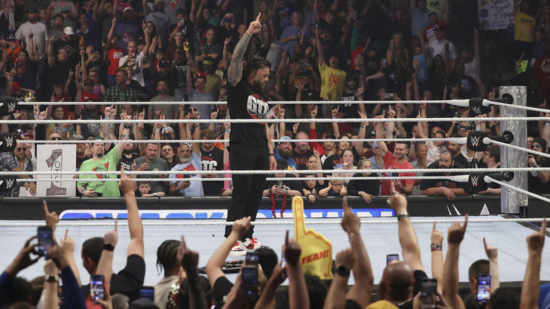 Roman Reign and the fan lift ones in the air